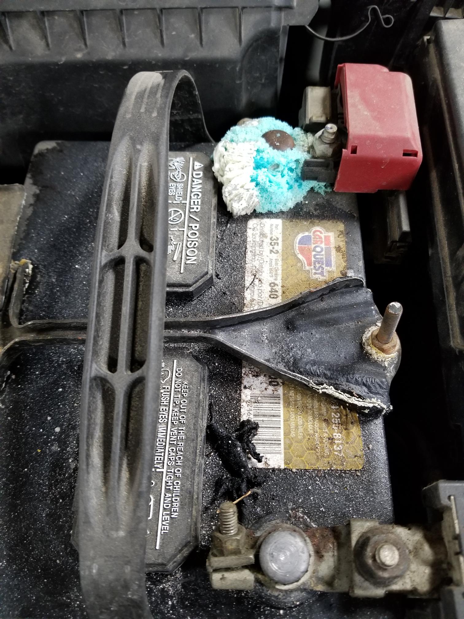 What is the crusty looking stuff on my Battery? Image